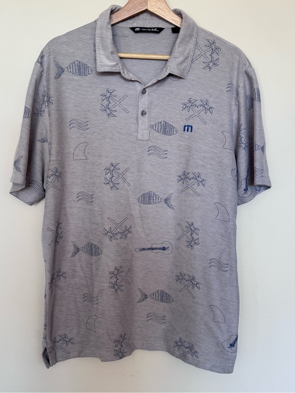 Men's Travis Mathew Light Gray Polo Golf Shirt with Subtle Fun Blue Summer Print